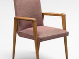 a close up of a chair with a pink upholstered seat