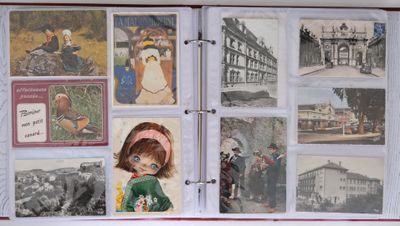 an open book with pictures of people and animals on it