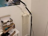 a picture of a bedroom with a bed and a lamp