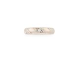 a white gold ring with a diamond set in the center