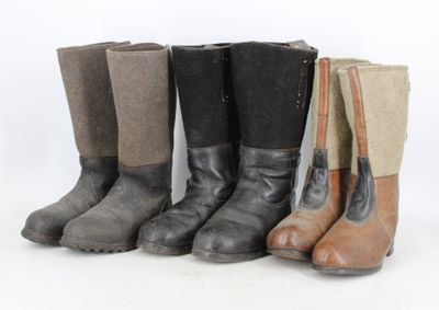 several pairs of boots are lined up in a row
