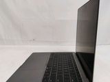 an open laptop computer sitting on top of a white surface