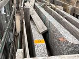 a large pile of granite blocks in a building