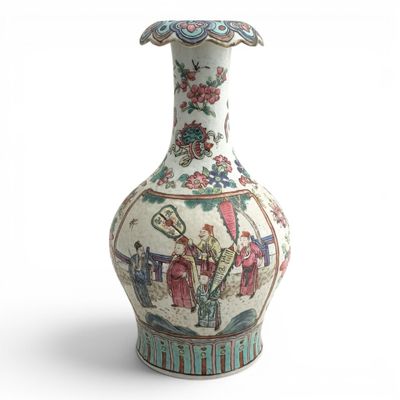 a vase that has a picture of people on it