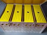a metal box with six yellow boxes inside of it