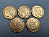 four gold sovereigns, one of which is a sovereign and the other of which is a sovereign
