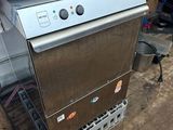 an image of a dishwasher sitting on top of a wooden table