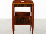 an image of a wooden table with a magazine rack on it