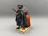 an image of a figurine of a man with a sword and a woman