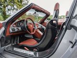 the interior of a sports car with the door open