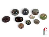 a lot of stones that are sitting on a white surface