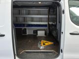 a white van with the door open and a sign on the floor