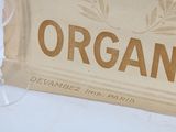 a box of organic wine next to a glass of wine
