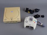 a video game console and a game controller on a table