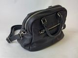 black leather handbag on white background with white background