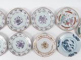 many plates with different designs on them on a white surface