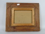 an old picture frame with a picture of a dog in it