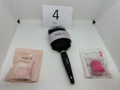a hair brush and a comb on a white table