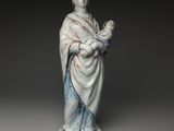 l'image d'une statue représentant une femme tenant un enfant dans ses bras