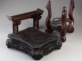 two chairs and a table that are sitting on a table
