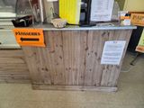 a wooden counter with a sign on it that says patisseries