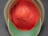 a close up of a hat with a red ball inside of it