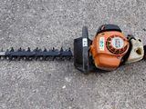 a chainsaw that is laying on the ground