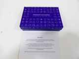 the box is open on a white table with a purple cover
