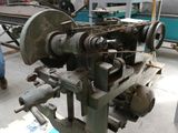 a man working on a machine in a factory