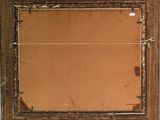 a picture of an old mirror hanging on a wall