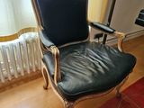 a chair that is sitting in front of a radiator