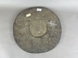 an image of a stone plate with a label on it