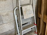a ladder that is leaning against a wall in a garage