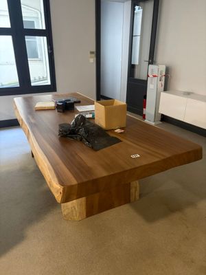 a large wooden table in the middle of a room