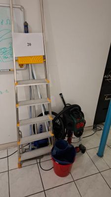 a ladder that is leaning against a wall in a room