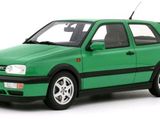the green car is parked on a white surface with a white background
