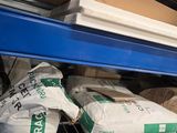 many bags of rice sitting on a shelf in a store