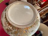 a white bowl sitting on top of a plate on a table