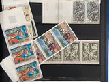 a lot of stamps on the table and a book