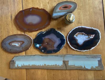 many different types of agate on a wooden table