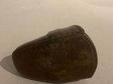 a small rock that is sitting on a white surface