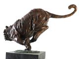 bronze statue of a tiger on a marble base on a white background