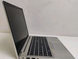 a laptop computer sitting on a table with a white background