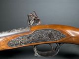 a close up of a gun on a black background with a gray background