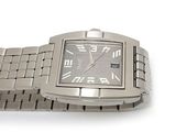a close up of a wrist watch on a white surface