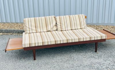 a couch that is sitting on a wooden table