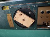 a piece of wood sticking out of the side of a machine