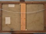 an image of a painting on a wooden easel with a piece of paper taped to it