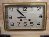 a clock that is sitting on the wall in the room