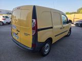 the back of a yellow van parked in a parking lot